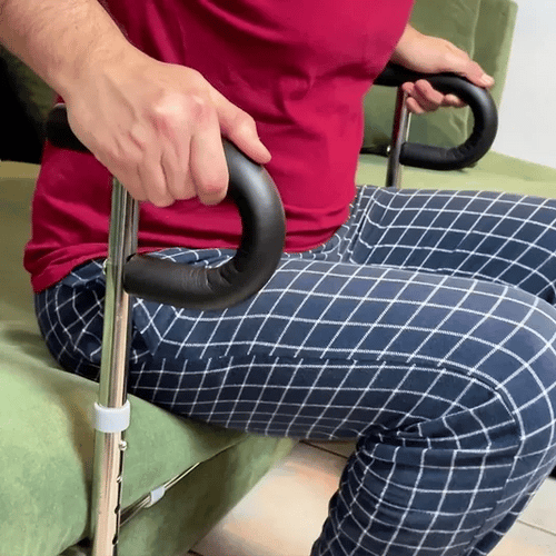 SteadyRail mounted under sofa, angled view showing adjustable legs